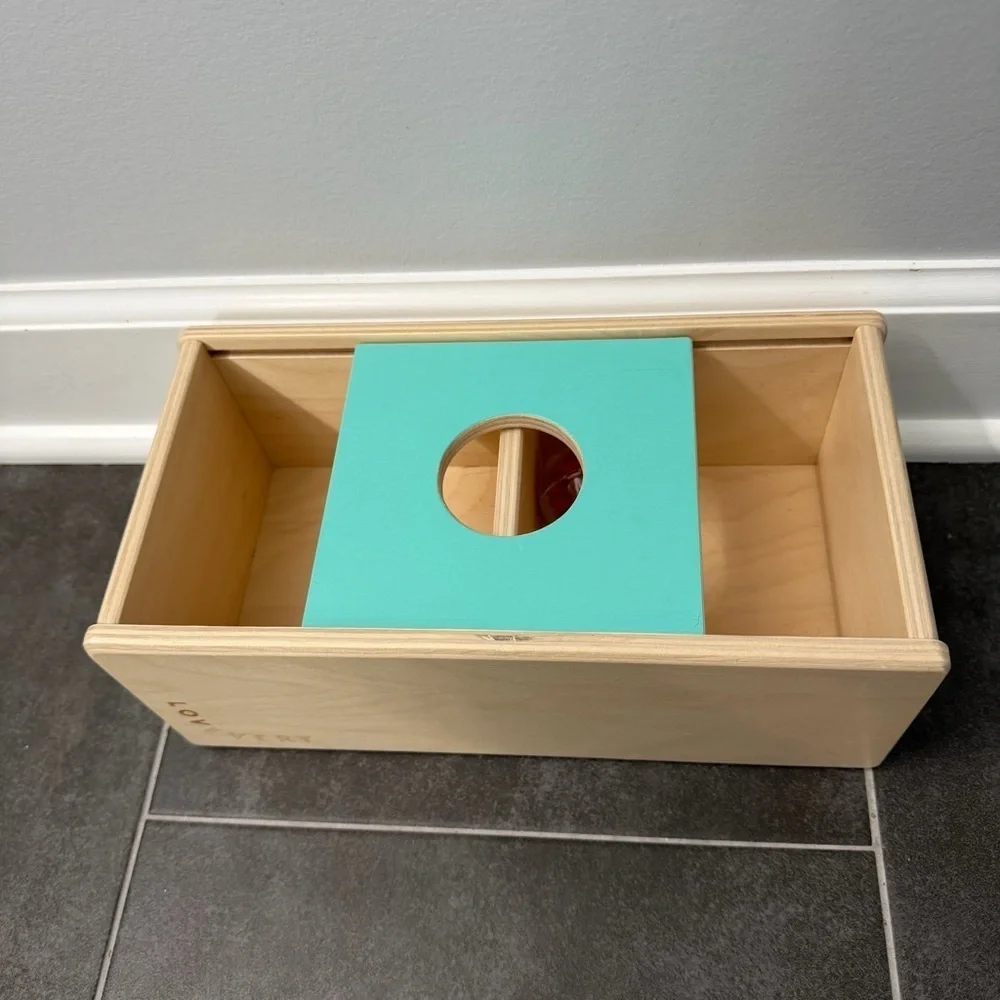 Lovevery Sliding Top Box with Plastic Rattle Ball from the Thinker Play Kit